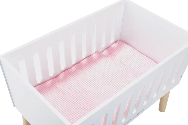 Inclusief roze beddengoed.